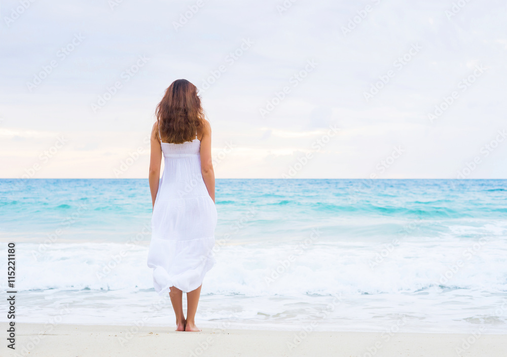 Beautiful brunette going to the wavy ocean Beautiful brunette going to the wavy ocean