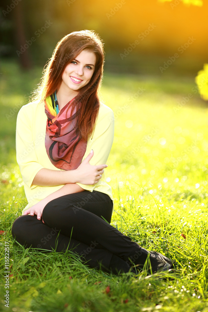 Attractive young woman enjoying her time outside in park Attractive young woman enjoying her time outside in park