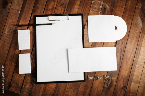 Blank stationery set on wooden table background. ID template. Mock up for branding identity for designers. Responsive design mock-up. Top view. photo