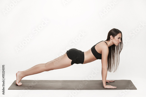 Woman exercising on mat