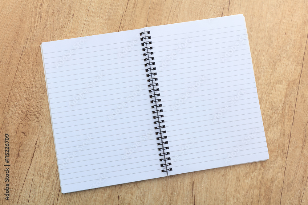 notepad on a wooden surface notepad on a wooden surface