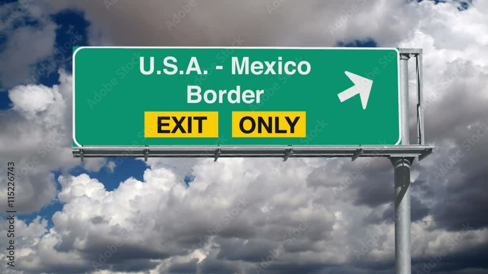 USA Mexico border crossing exit sign with time lapse clouds.