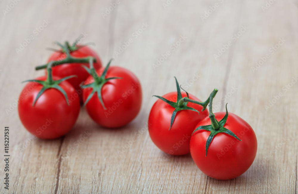 cherry tomatoes on a wooden surface cherry tomatoes on a wooden surface