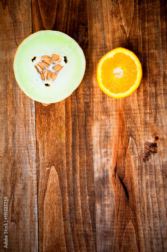 Fresh juicy fruits on a wooden background