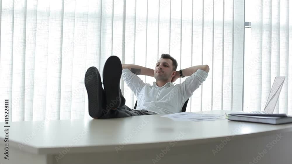 The young man rest in the office The young man rest in the office