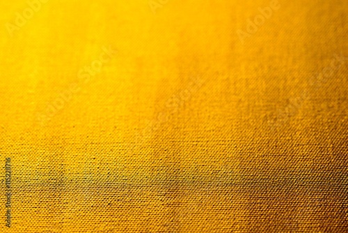 Golden angemalte Leinwand als Hintergrund, geringe Tiefenschärfe photo
