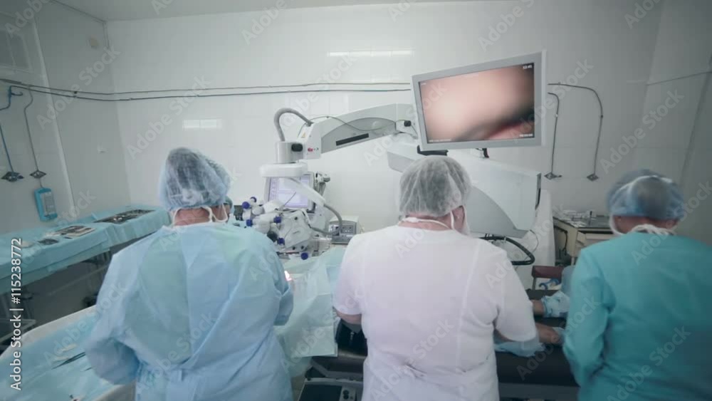 Medical team performing operation in hospital operating theater. 1080p. Medical team performing operation in hospital operating theater. 1080p.