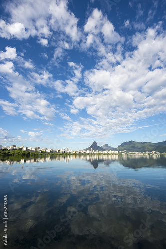 Scenic skyline morning view of Lagoa Rodrigo de Freitas lagoon in Rio de Janeiro, Brazil with Ipanema and Leblon reflecting on the calm horizon 