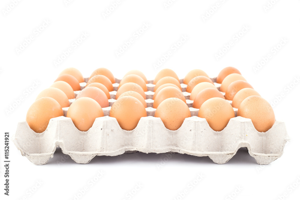 Chicken eggs in a box isolated on white background. Chicken eggs in a box isolated on white background.