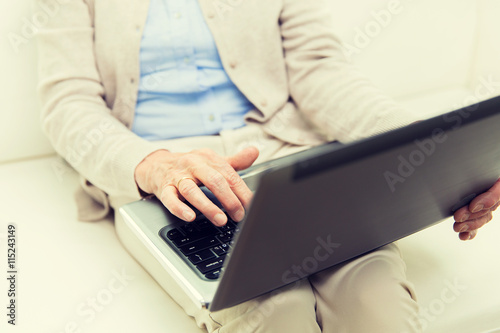 close up of senior woman with laptop at home