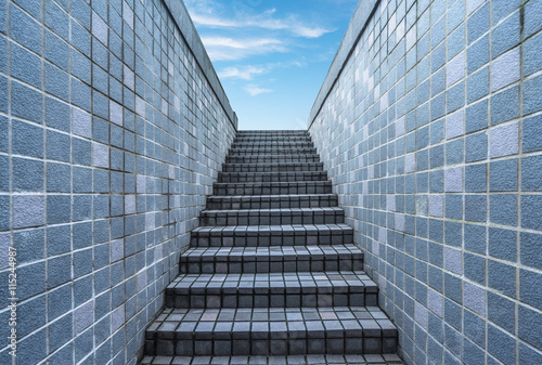 tiled stairs toward blue sky