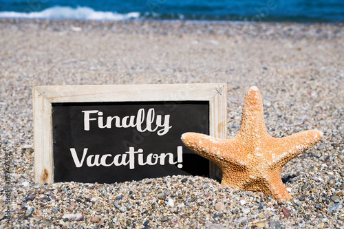 starfish and chalkboard with the text finally vacation