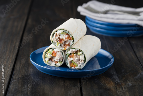 Tuna burritos with avocado tomato and mayonnaise