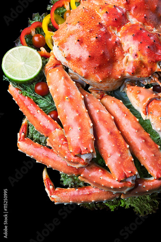 Top view of Red king crab served on black background