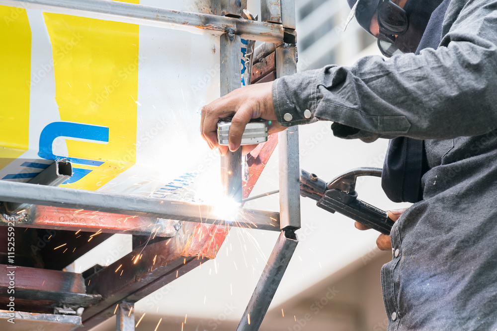 Sparks and drops of molten metal during work of welder.
Sparks and drops of molten metal during work of welder.
