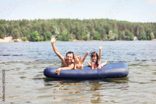 Family floating on mattresses.