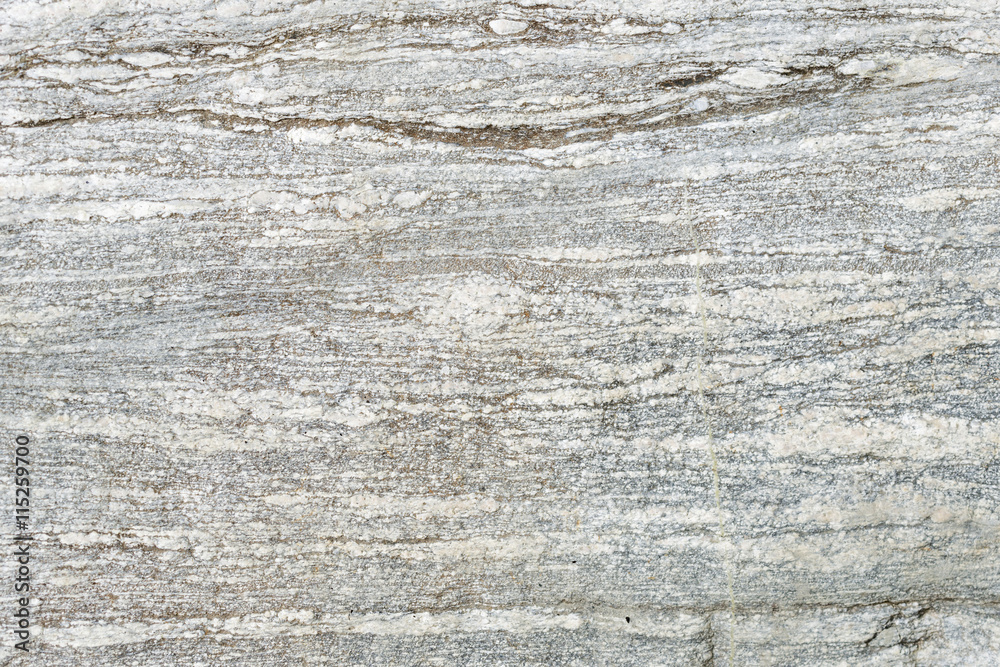Textured background of a granite rock polished be glaciers during the ice age. Textured background of a granite rock polished be glaciers during the ice age.