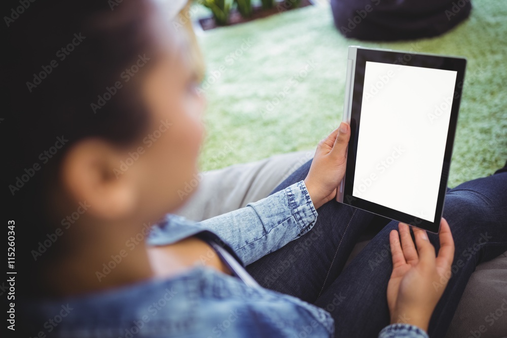 High angle view of businesswoman holding digital tablet