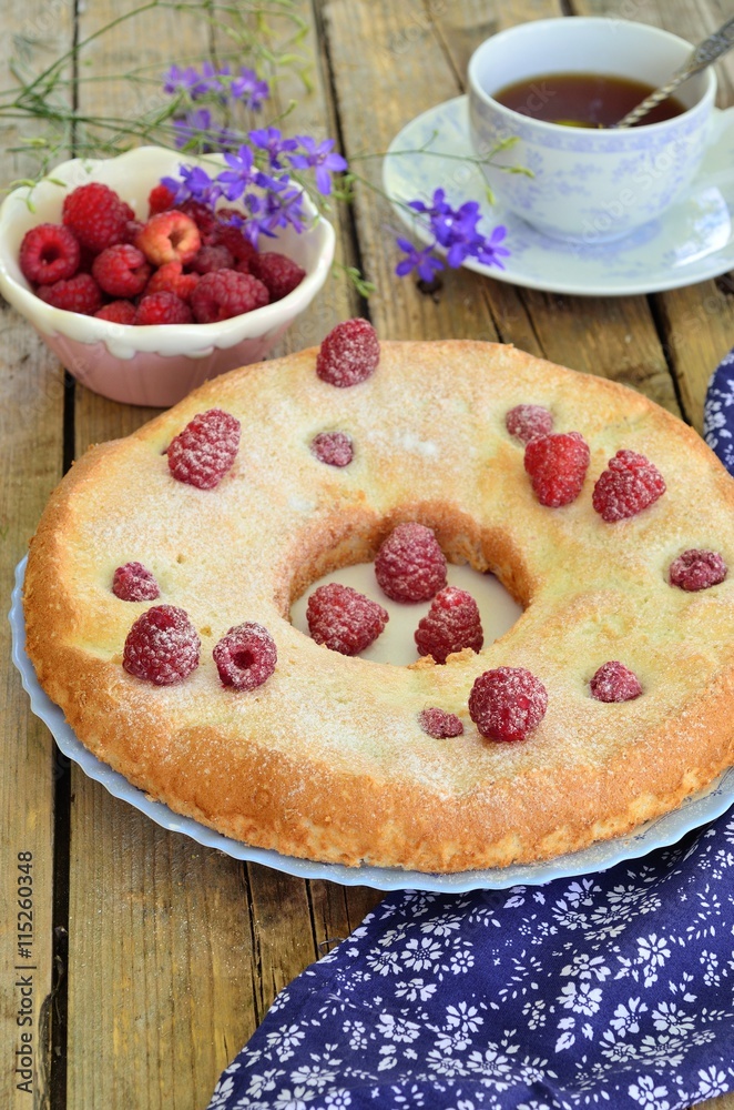 Cake with raspberries on a wooden background. Cake with raspberries on a wooden background.