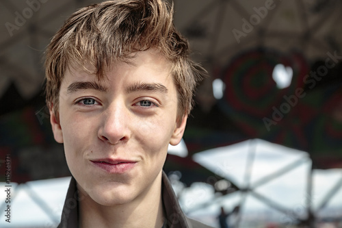 close up portrait of a smiling teenage boy