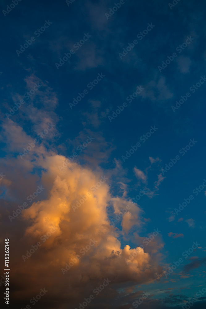 Clouds in the evening sky illuminated by the sun has sat down fo