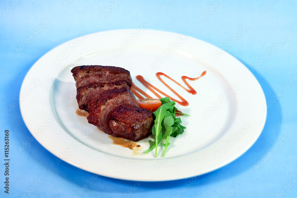 Modern food on a white plate and blue background Modern food on a white plate and blue background