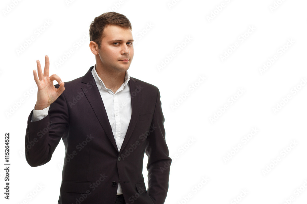 Handsome businessman shows okay gesture Handsome businessman shows okay gesture
