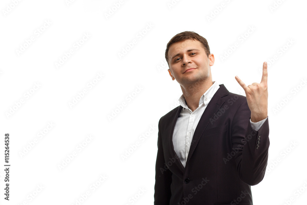 Handsome businessman shows rock gesture Handsome businessman shows rock gesture