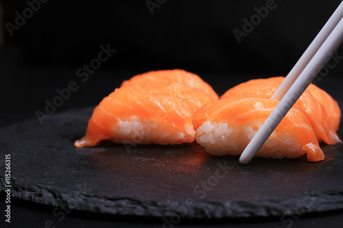 Salmon Nigiri Sushi on black background.