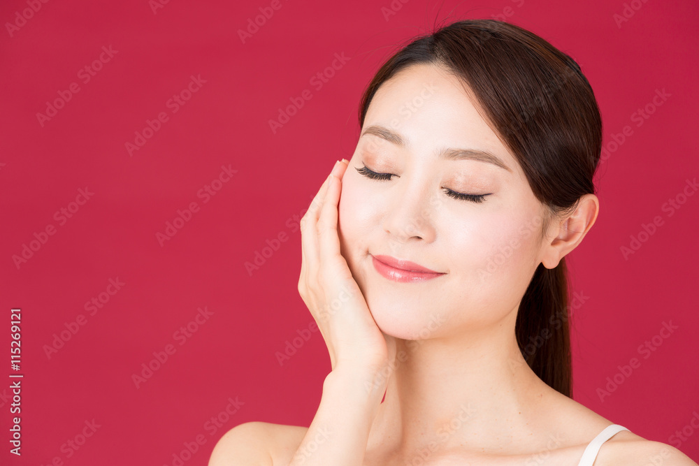 attractive asian woman isolated on red background attractive asian woman isolated on red background