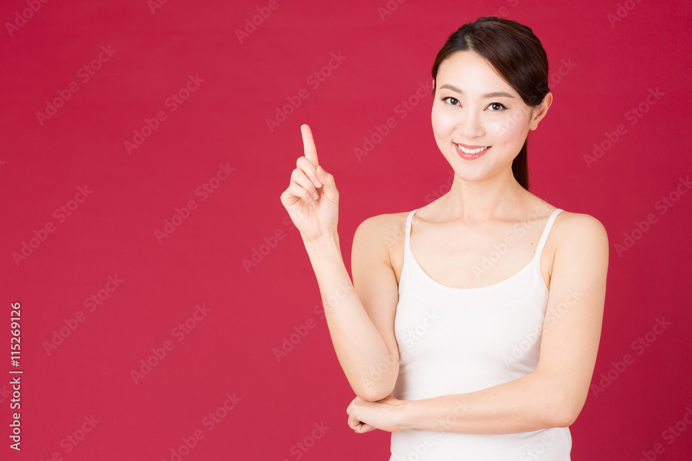 attractive asian woman isolated on red background attractive asian woman isolated on red background