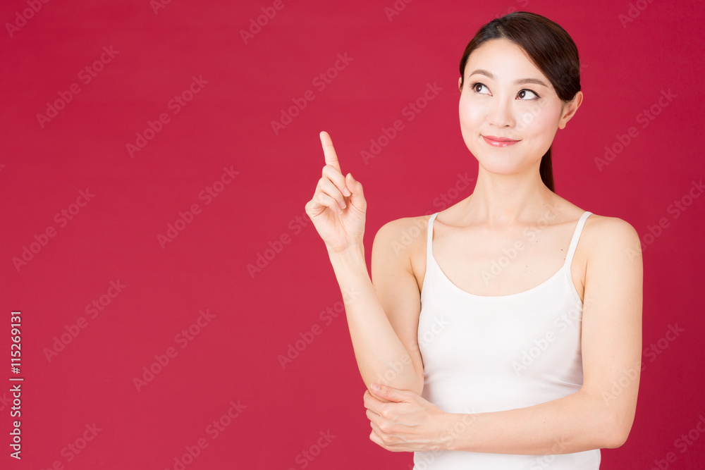 attractive asian woman isolated on red background attractive asian woman isolated on red background