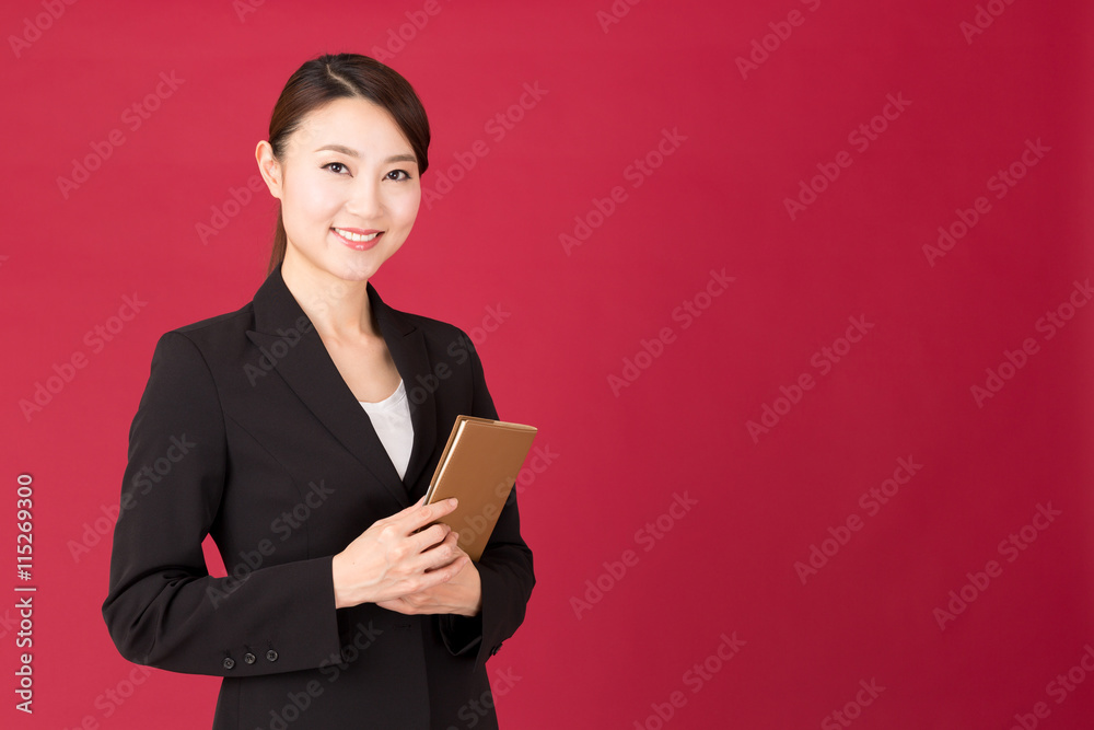 asian businesswoman isolated on red background