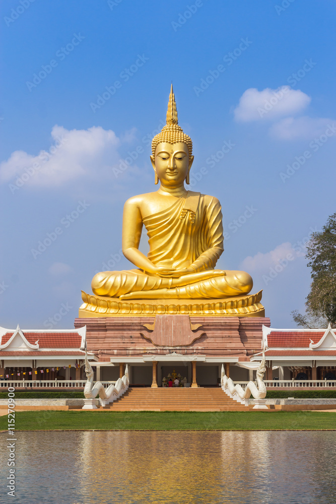 big golden buddha statue sitting in thai temple on blue sky background big golden buddha statue sitting in thai temple on blue sky background