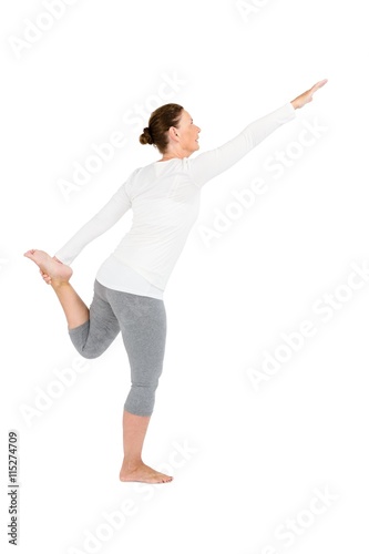Full length of mature woman exercising