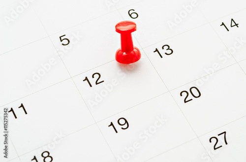 Red Thumb Tack on Calendar.