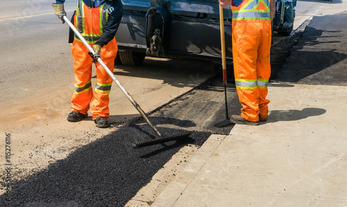 Construction site road repair with asphalt patching