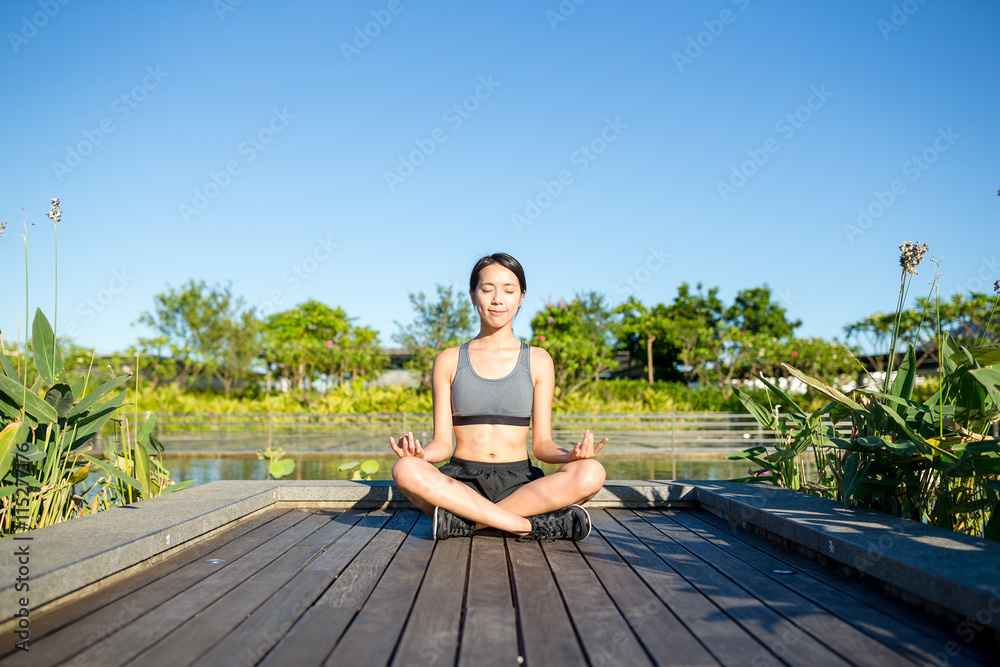 Woman doing Yoga at outdoor