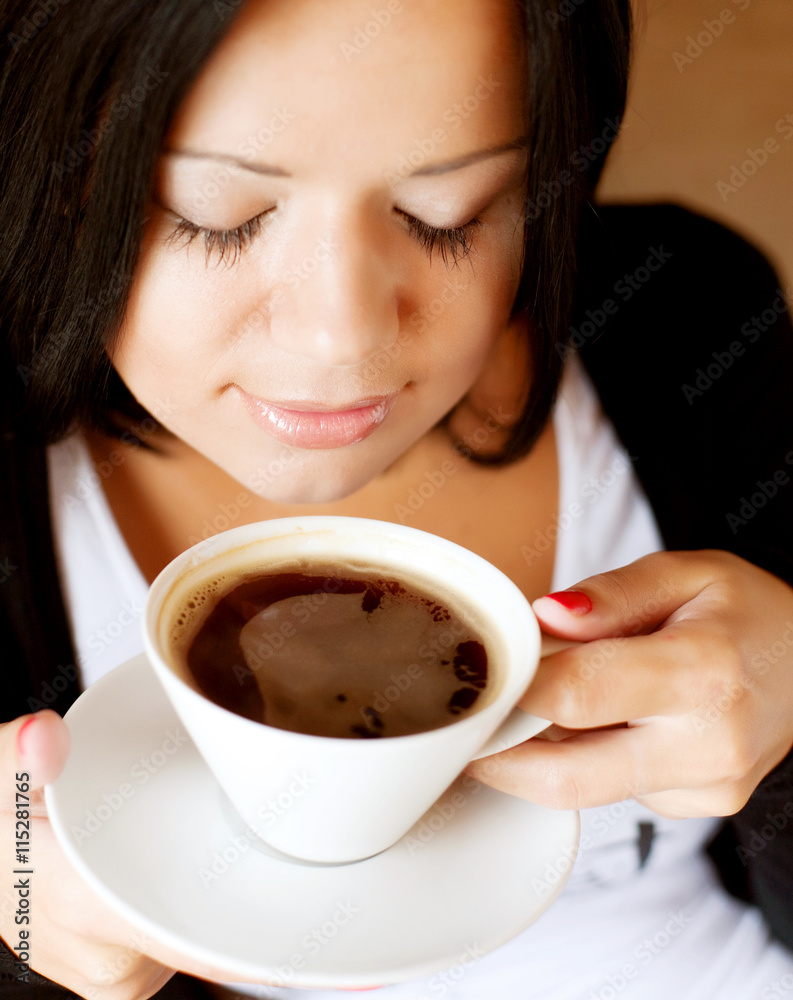 young woman sitting in a cafe drinking coffee young woman sitting in a cafe drinking coffee