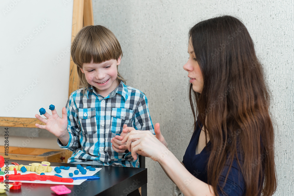 child kid boy and mother play colorful clay child kid boy and mother play colorful clay