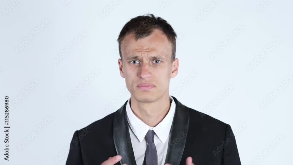 Confused and upset businessman with sad expression Confused and upset businessman with sad expression