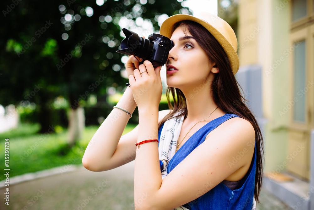 Outdoor summer smiling  young girl having fun in the city with camera travel photo of photographer Making pictures