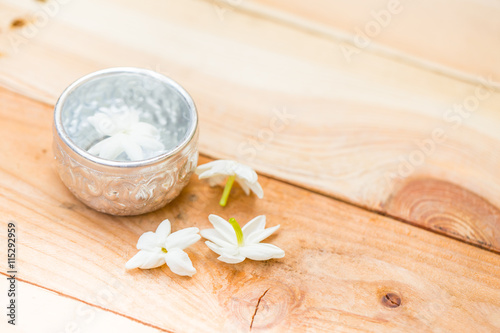 water in silver bowl with jasmine white flower, Thailand Songkarn