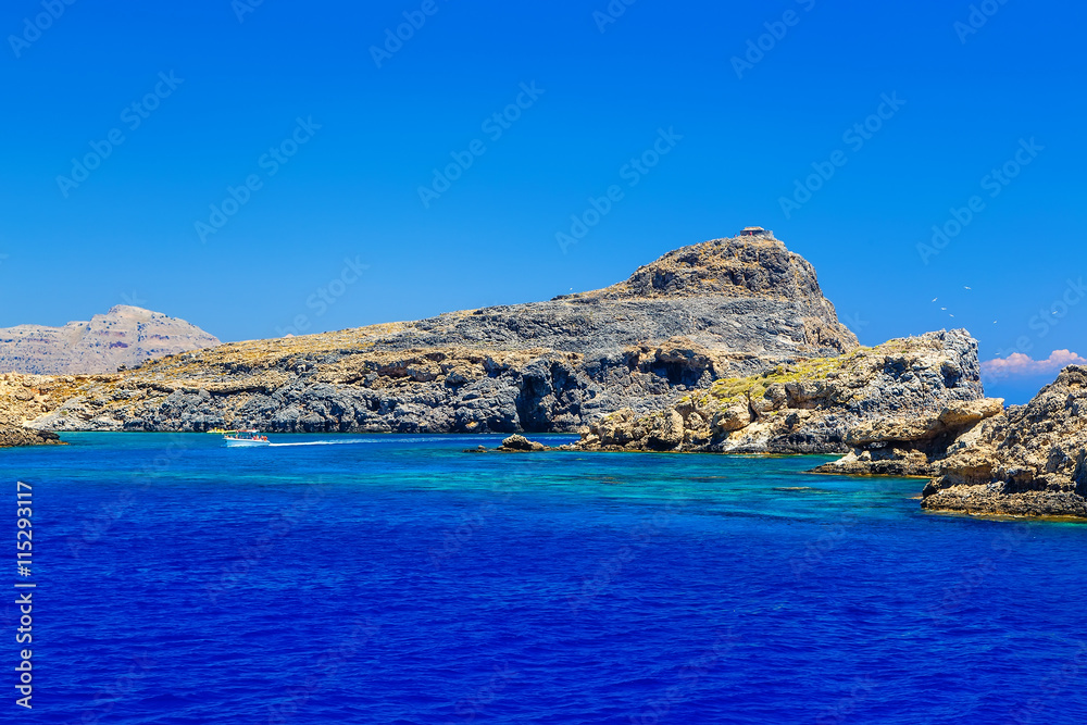 rocks in the sea near the ancient city of Lindos, view from the sea