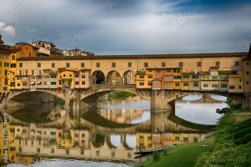 Ponte Vecchio bridge over the river Arno. Bridge was opened in 1345 and is one of the biggest tourist attractions in Florence. Italy