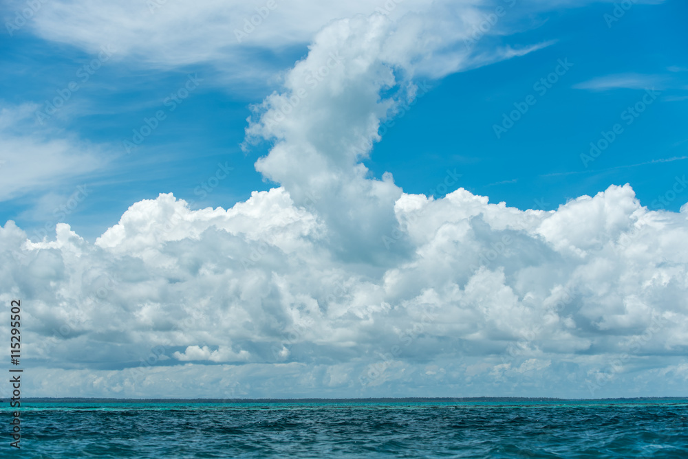 Fluffy white clouds on blue sky by the sea Fluffy white clouds on blue sky by the sea