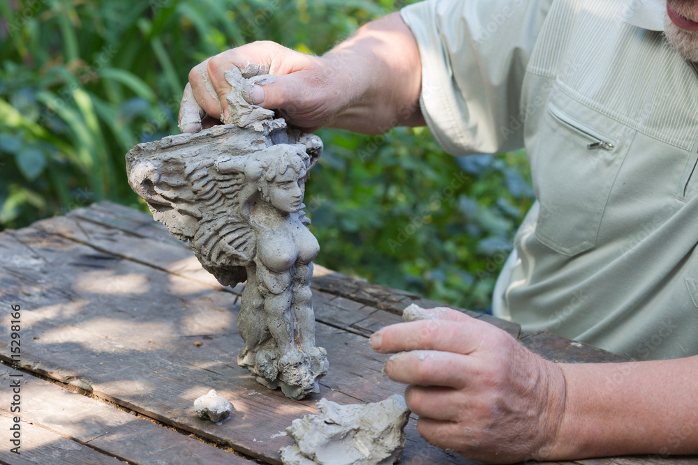 sculptor creates a sculpture