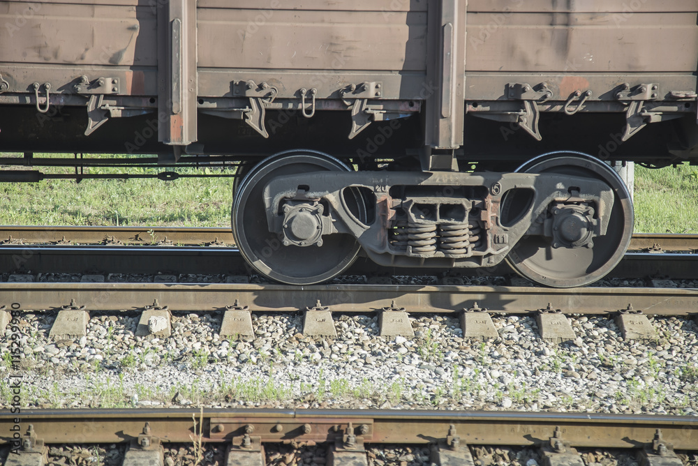 Naklejka premium Wheels of train on railway station