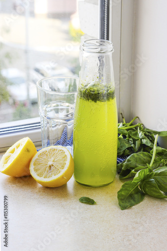 Summer drink with lemon, basil and soda