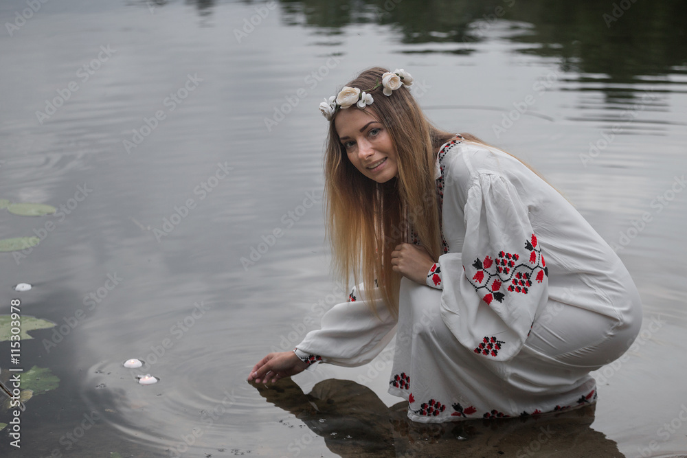 Fototapeta premium young beautiful girl in the Belarusian traditional dress with a wreath
